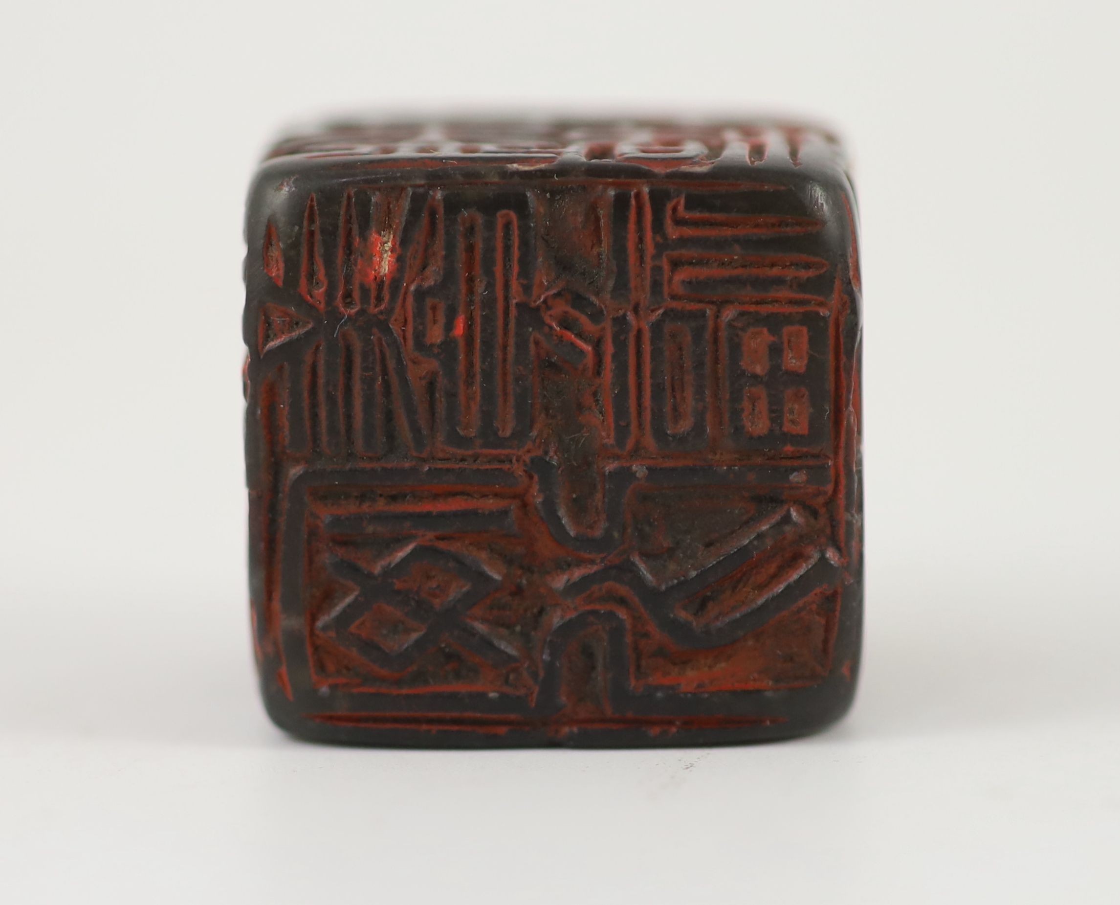 A Chinese dark green soapstone cube shaped seal, probably Qing dynasty, 3 cm